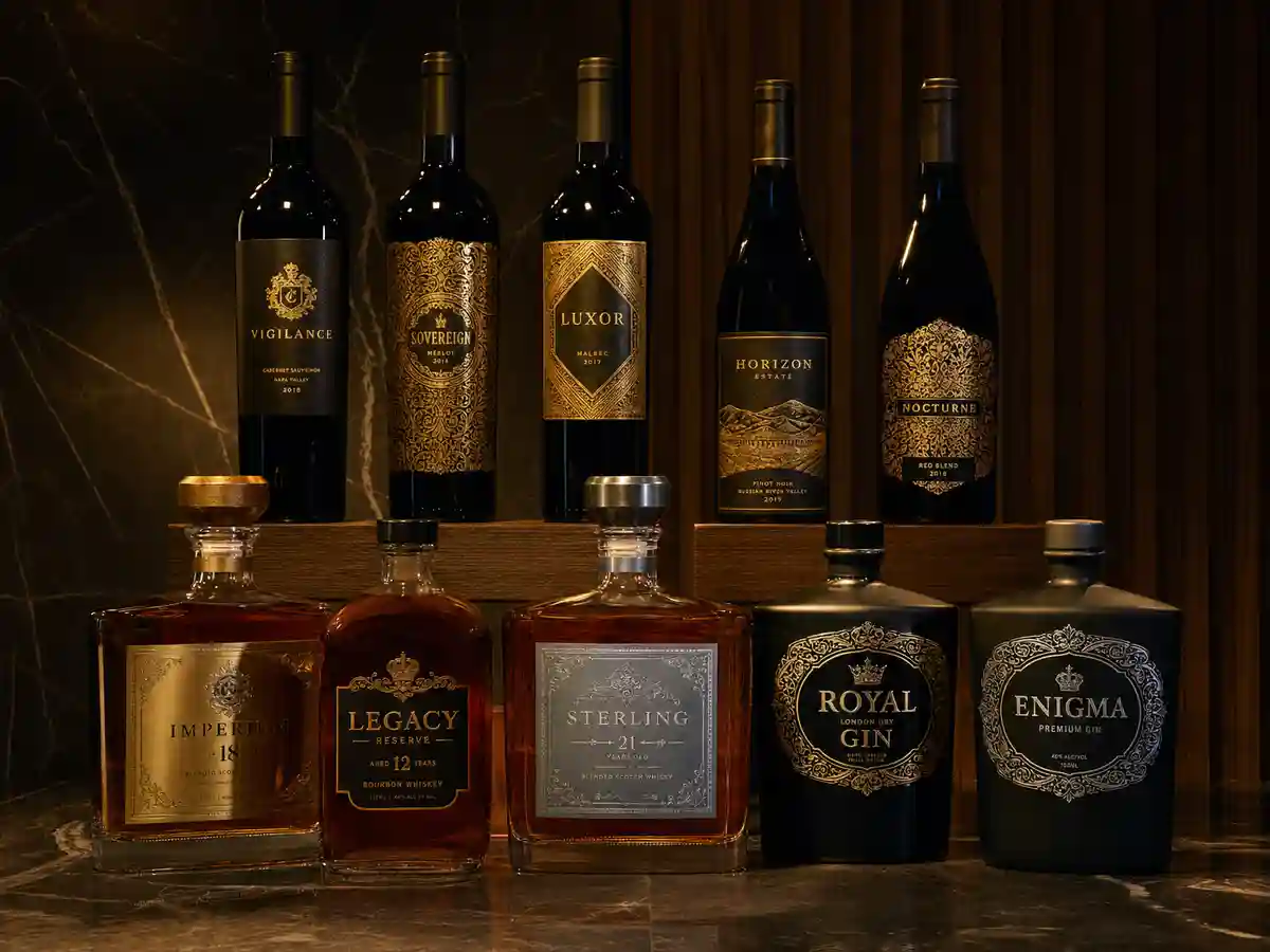 Gold foil labels on premium wine and spirits bottles